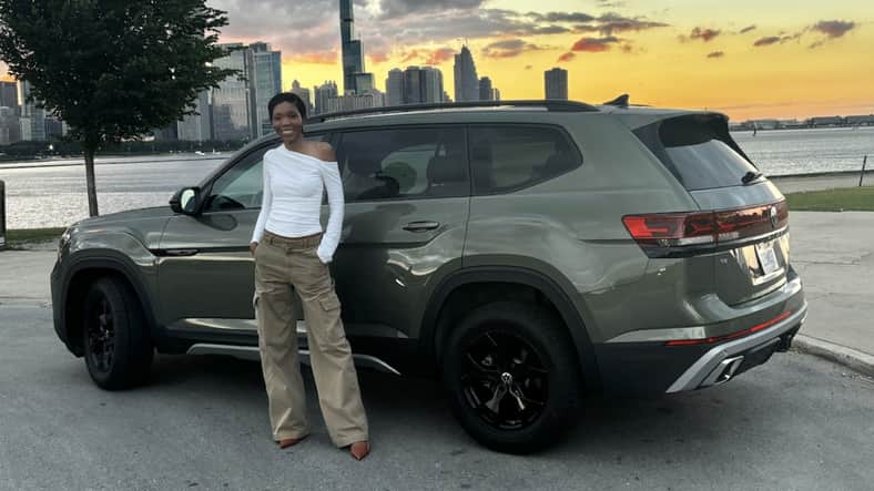 Corliss standing with the 2026 VW Atlas