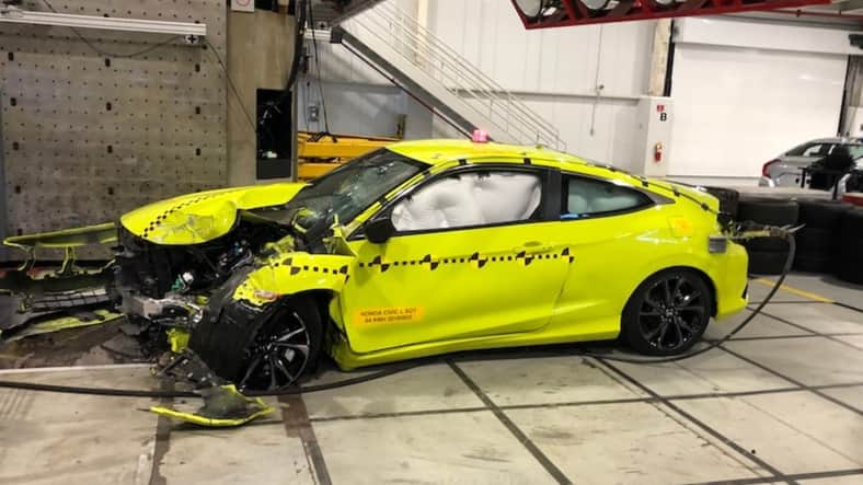A crashed Honda Civic, a result of a crash test demonstration