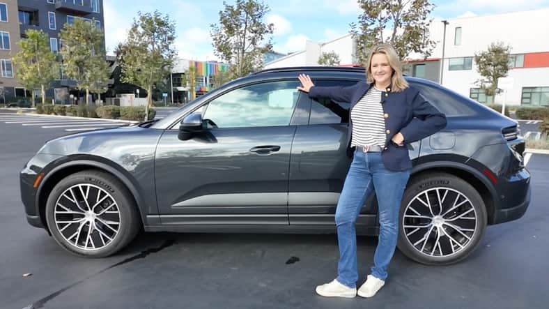 Scotty standing with the Porsche Macan