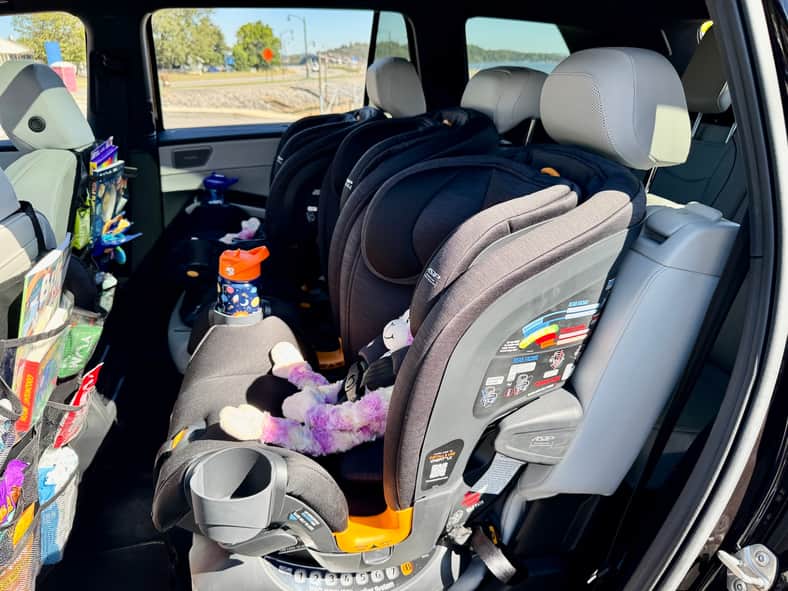 The 2027 VW Atlas with 3 car seats installed across the center bench 2