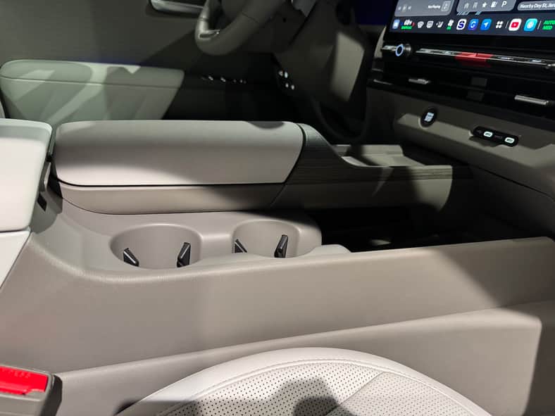 The center console was designed with rounded edges and a lowered cup holder that doesn't block the climate control buttons