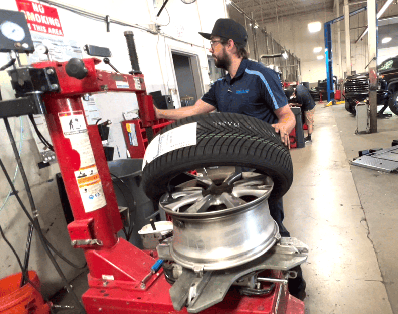 The Kumho tires being installed on my car's wheels